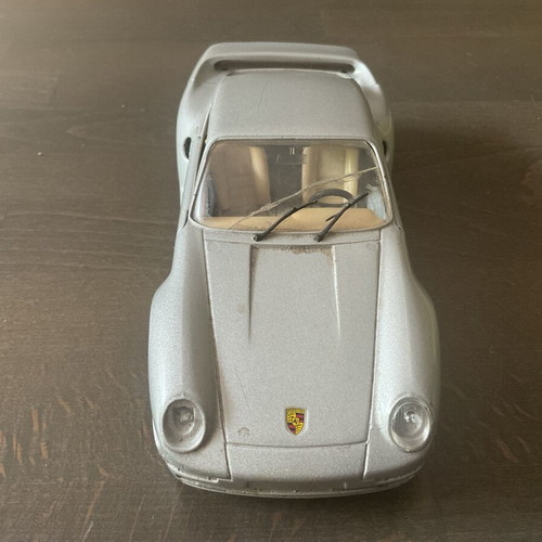 Burago metal toy car Porsche 959 M1:24 used with missing headlight and cracked glass