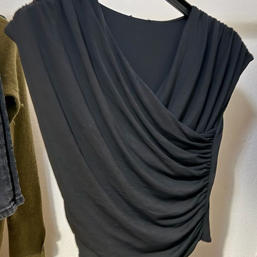 Women's black blouse with draped neckline and pleats used, size S