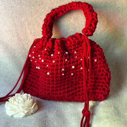 Handmade red drawstring bag with pearls