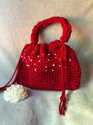 Handmade red drawstring bag with pearls