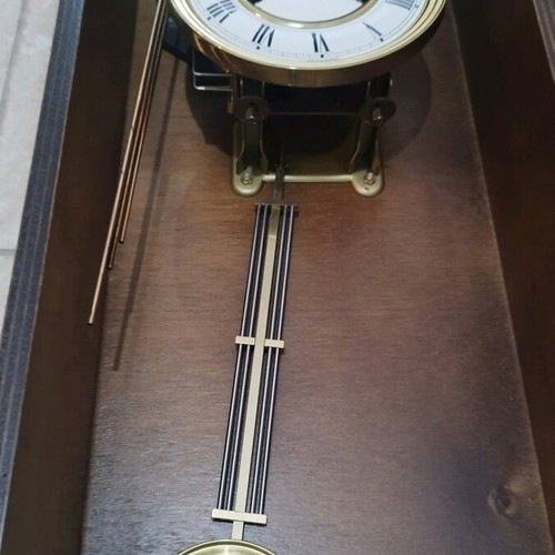 Wooden wind-up pendulum clock used with Asso mechanism