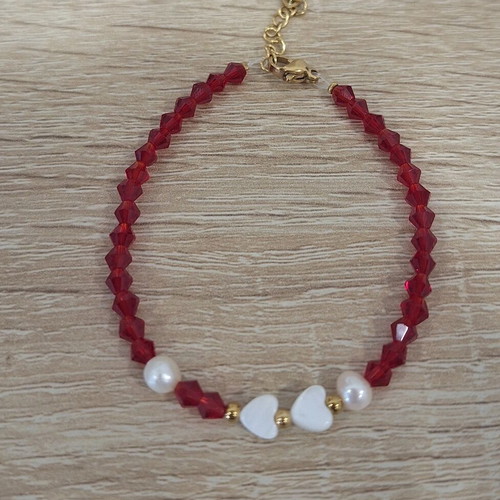 Handmade bracelet with crystals, pearls and heart-shaped coral made to order
