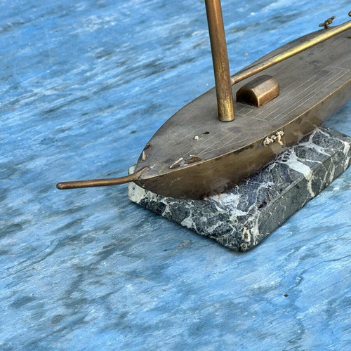 Vintage brass sailboat decoration on marble base, used