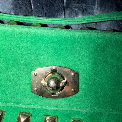 Green suede crossbody bag used with gold details