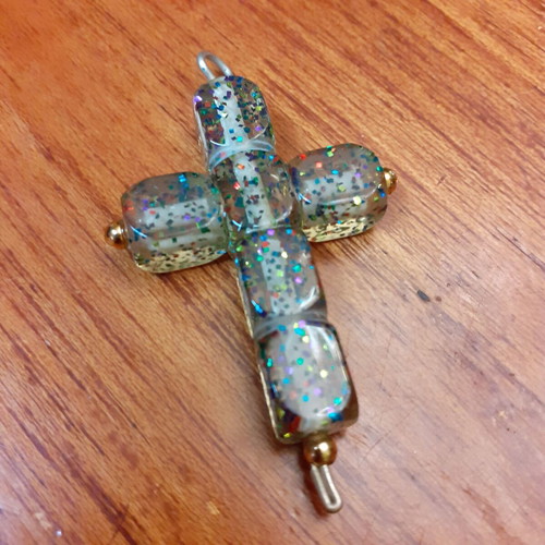 Cross large with glitter used, synthetic material