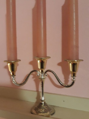 Metal candlestick like new with candles