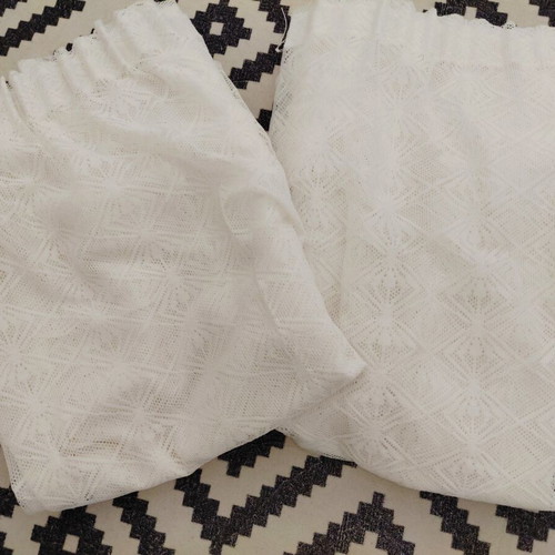 Two sewn white lace curtains, 2.5m height, 1.5m width each
