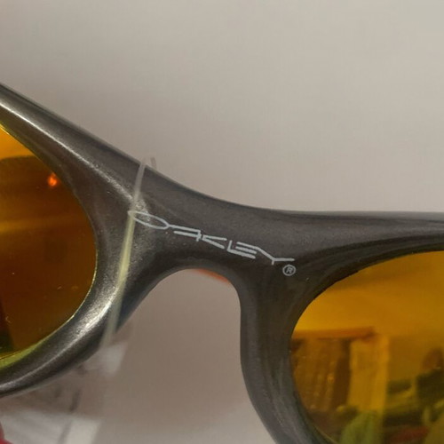 Oakley sunglasses, orange with gold lime chameleon lenses