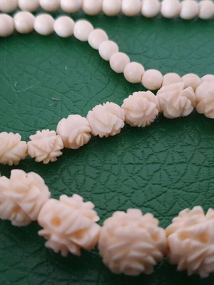 Vintage carved bone necklace with rose details