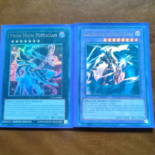 Dark Magician the Dragon Knight and Ebon High Magician cards near mint