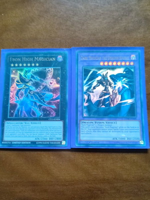 Dark Magician the Dragon Knight and Ebon High Magician cards near mint