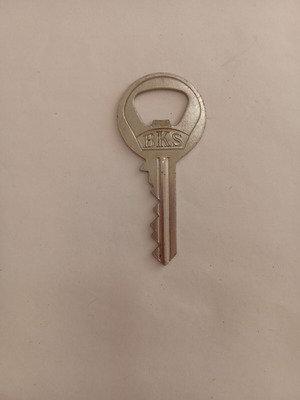 Key-shaped bottle opener used by BKS