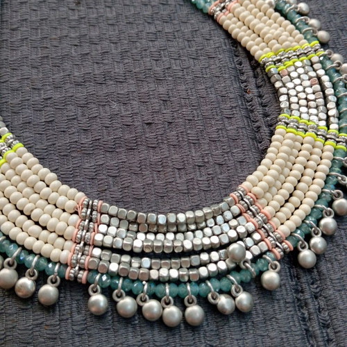 Accessorize multistrand necklace with plastic and glass beads