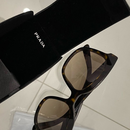 Prada SPR 24Q sunglasses used, brown tortoise design with case