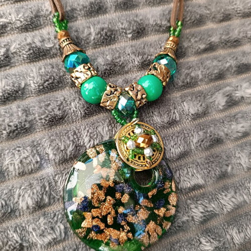 Necklace with green beads and glass pendant used