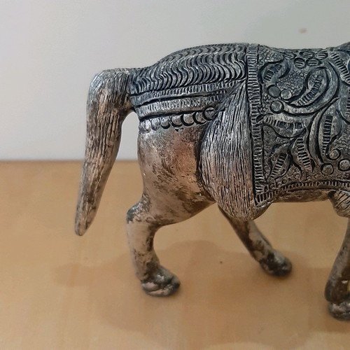 Vintage metal horse used with carved details
