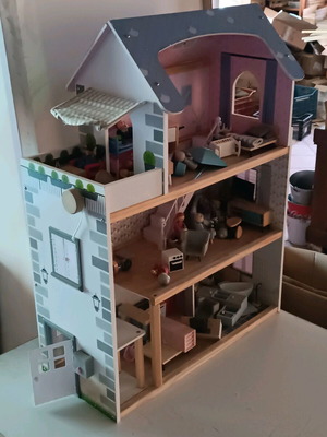 Wooden dollhouse used with extra accessories pack