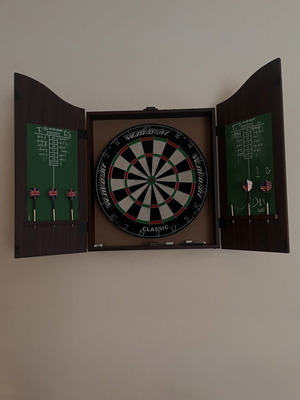 Luxury dartboard with cabinet like new