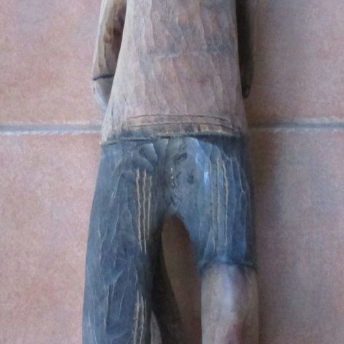 Wooden carved figure used from Colombia with traditional Pan flute