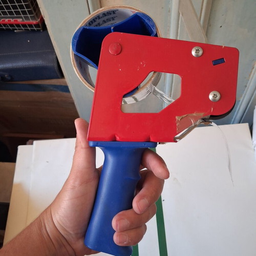 Packing tape gun used with roll included