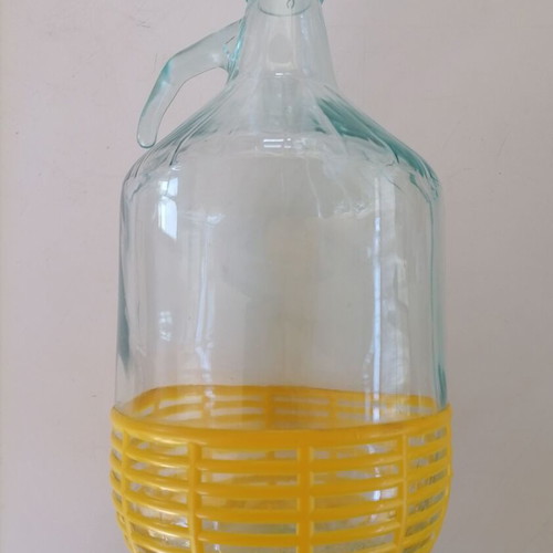 Glass 5-liter damigiana used with plastic protective base