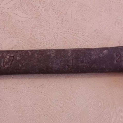 Old wrench with worn numbers and codes used