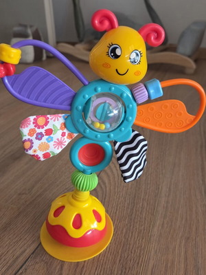 Baby toy with suction cup and teething parts