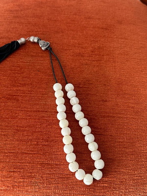 Worry beads with white beads used and metal details