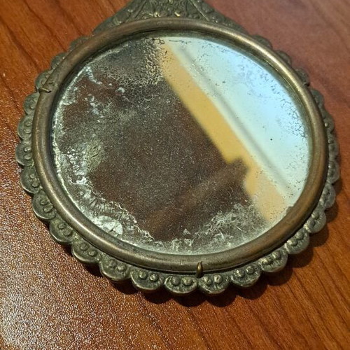 Brass hand mirror used with embossed peacock decoration