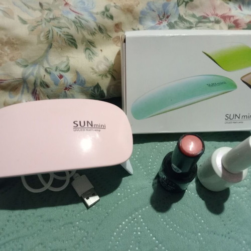 Gel Nail Dryer Machine with Pink Polish and Coat