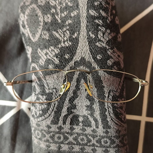 Vogue eyeglass frame used, gold color