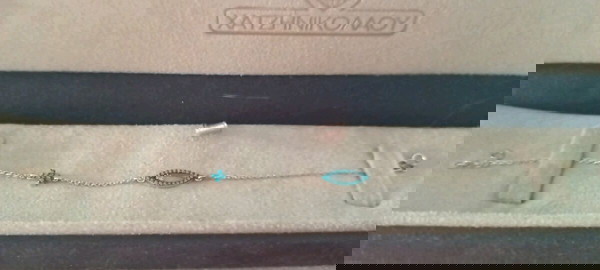 χρυσό βραχιόλι με μάτι και σταυρουδακι