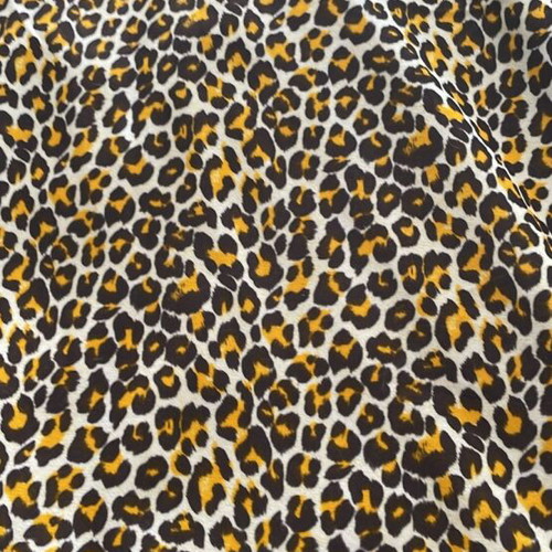 Animal print fabric for upholstery and throws, white with brown and orange