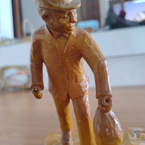 Handmade carved wooden man decoration used