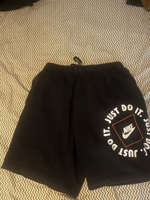 Nike Just Do It shorts, size M, black and orange