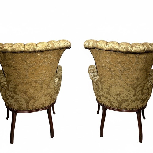 Hollywood Regency tufted armchairs used, mahogany carvings, set of two