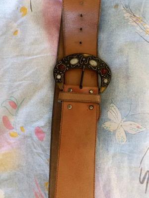 Vintage leather belt used with metal buckle and stones