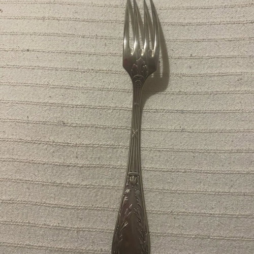 Vintage silver-plated food fork used with embossed decoration