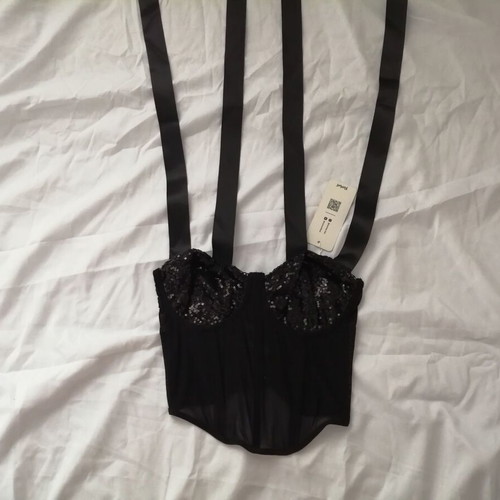 Women's black bustier corset top with sequins and sheer waist