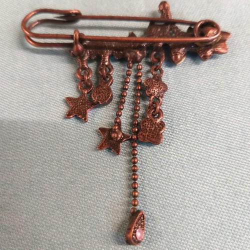 Bronze safety pin brooch with variety of flowers