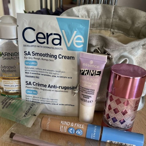 Beauty Bazaar Silver Pouch with Cosmetics Like New, 7 Pieces