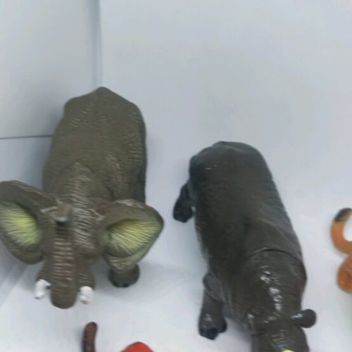 Plastic jungle animals and small dinosaurs used
