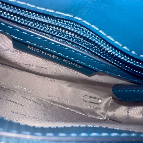 Michael Kors blue crossbody bag like new with studs