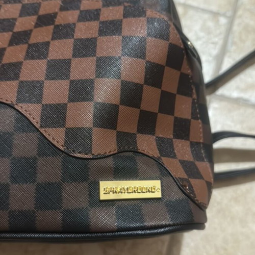 Sprayground backpack like new, brown and black