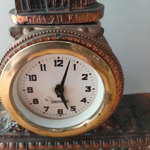 Copper German wind-up clock used with cathedral motif