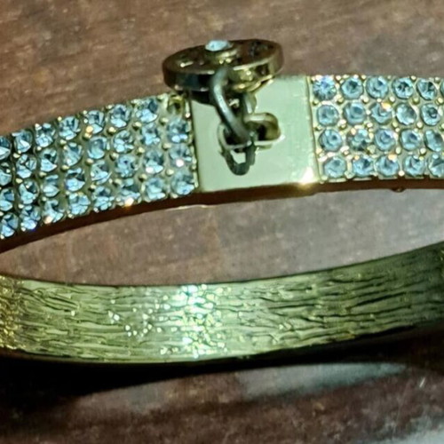 Guess women's bracelet, gold plated with missing stones