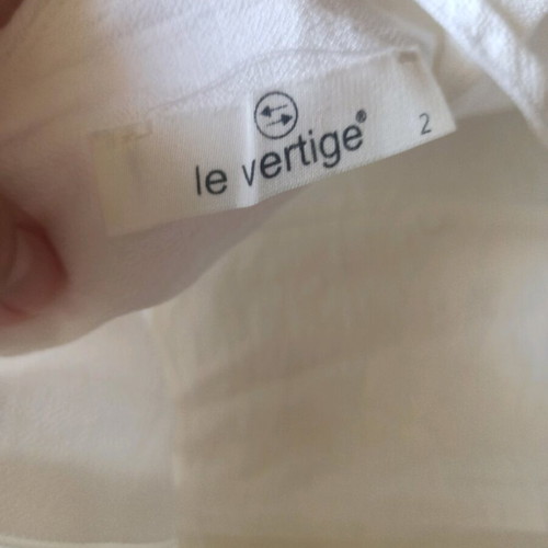 Le Vertige women's white jumpsuit size small like new with belt