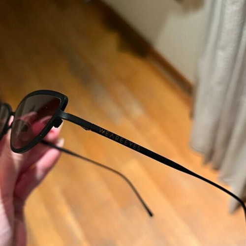 Sunglasses new with thin black frame and pink lens
