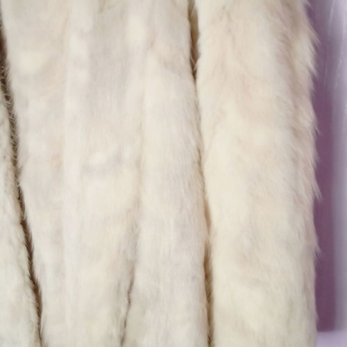 Mink fur coat in off-white and light gray, slightly worn