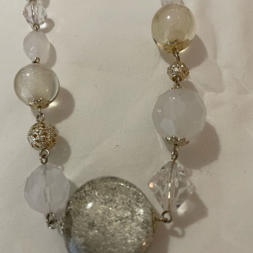 Vintage bead necklace used in clear, white, and silver tones